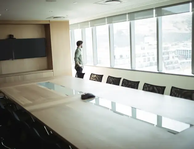businessman-looking-through-window-in-meeting-room-2025-04-03-02-30-13-utc